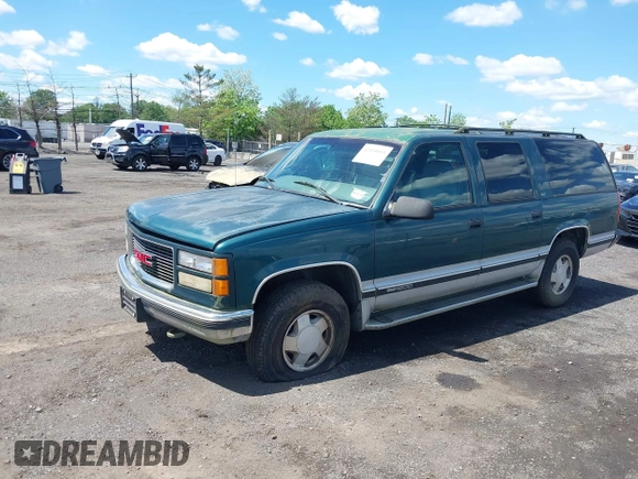1997 GMC Suburban with VIN 1GKFK16R6VJ706590, listed as a IAAI auction lot 42194855 with 155,680 mi miles and . Bid and sale history available at DreamBid. Image 2.