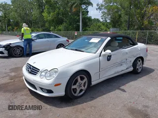 2005 Mercedes-Benz CLK 5.0L with VIN WDBTK75J55F123328, listed as a IAAI auction lot 42082590 with 58,969 mi miles. Bid and sale history available at carsss.com. Image 2.