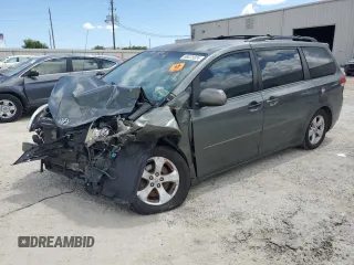 2014 Toyota Sienna LE AAS with VIN 5TDKK3DC5ES423802, listed as a Copart auction lot 69075824 with Not Provided miles and Salvage Title. Bid and sale history available at DreamBid. Image 1.