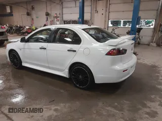 2014 Mitsubishi Lancer GT with VIN JA32U8FWXEU016230, listed as a IAAI auction lot 41379899 with 108,511 mi miles. Bid and sale history available at carsss.com. Image 3.