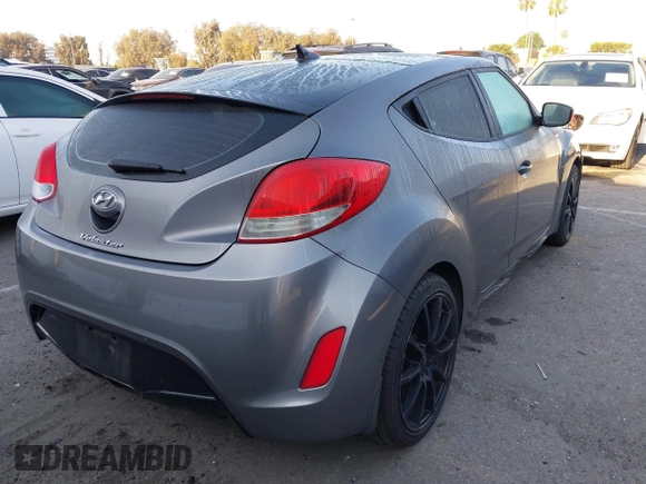 2012 Hyundai Veloster w/Gray Int z VIN KMHTC6AD1CU082872, wystawiony jako IAAI lot #41980406 z przebiegiem 132 804 mil mil oraz . Historia ofert i sprzedaży dostępna na DreamBid. Obrazek 4.