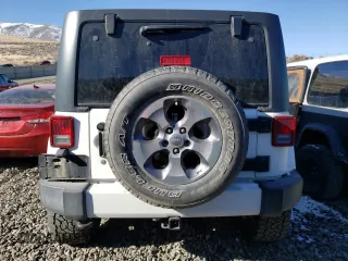 2016 Jeep Wrangler Unlimited 75th Anniversary with VIN 1C4HJWEG3GL185999, listed as a Copart auction lot 42060225 with 112,769 mi miles and Salvage title. Bid and sale history available at DreamBid. Image 6.