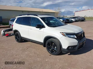 2019 Honda Passport Elite z VIN 5FNYF8H0XKB001472, wystawiony jako IAAI lot #42143890 z przebiegiem 98 119 mil mil oraz . Historia ofert i sprzedaży dostępna na DreamBid. Obrazek 1.