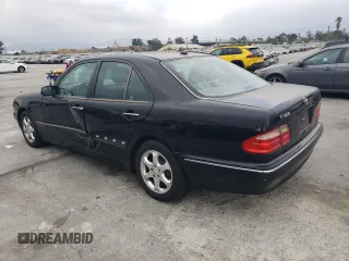 2002 Mercedes-Benz E-Class with VIN WDBJF65J42B486633, listed as a Copart auction lot 76979054 with 151,429 mi miles and Salvage Title. Bid and sale history available at carsss.com. Image 2.