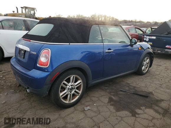 2014 MINI Convertible with VIN WMWZN3C53ET861225, listed as a Copart auction lot 87791665 with 104,151 mi miles and Salvage title. Bid and sale history available at DreamBid. Image 3.