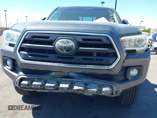 2018 Toyota Tacoma SR with VIN 5TFRX5GN1JX118441, listed as a IAAI auction lot 41870266 with 95,612 mi miles and . Bid and sale history available at DreamBid. Image 12.