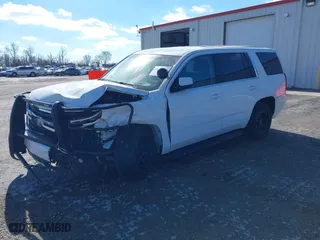 2020 Chevrolet Tahoe Commercial with VIN 1GNSKDEC2LR217697, listed as a IAAI auction lot 40815499 with 128,503 mi miles. Bid and sale history available at carsss.com. Image 2.