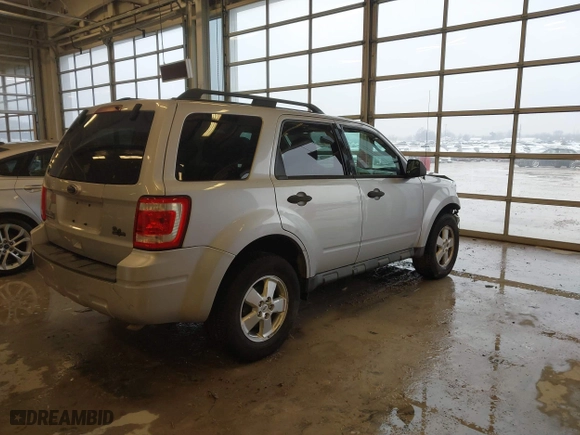 2010 Ford Escape XLT with VIN 1FMCU0D70AKB09942, listed as a IAAI auction lot 41572582 with 218,296 mi miles. Bid and sale history available at carsss.com. Image 4.