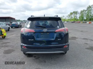 2018 Toyota RAV4 XLE with VIN JTMWFREV9JJ165655, listed as a IAAI auction lot 42138998 with 123,569 mi miles and . Bid and sale history available at carsss.com. Image 16.