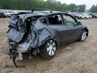 2023 Tesla Model Y Long Range z VIN 7SAYGDEE7PF870370, wystawiony jako Copart lot #55700135 z przebiegiem 32 410 mil mil oraz Szkoda całkowita • Salvage title. Historia ofert i sprzedaży dostępna na DreamBid. Obrazek 3.