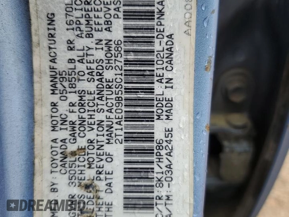 1995 Toyota Corolla DX with VIN 2T1AE09B5SC127586, listed as a Copart auction lot 57075045 with 244,969 mi miles and Salvage title. Bid and sale history available at DreamBid. Image 12.