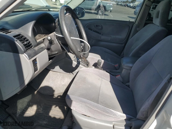 2003 Suzuki Grand Vitara with VIN JS3TD62V734102584, listed as a Copart auction lot 77210564 with 148,477 mi miles and Salvage Title. Bid and sale history available at carsss.com. Image 7.