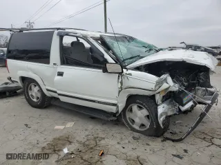 1999 Chevrolet Tahoe with VIN 3GNEK18R7XG230110, listed as a Copart auction lot 82932774 with 148,055 mi miles and Salvage Title. Bid and sale history available at carsss.com. Image 4.