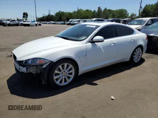 2014 Jaguar XF V6 SC with VIN SAJWJ0EF9E8U15090, listed as a Copart auction lot 58928734 with 71,663 mi miles and Salvage Title. Bid and sale history available at carsss.com. Image 1.