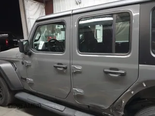 2022 Jeep Wrangler Unlimited Sport with VIN 1C4HJXDG0NW117632, listed as a IAAI auction lot 41185850 with 18,298 mi miles and . Bid and sale history available at DreamBid. Image 14.