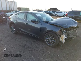 2018 Mazda 3 Grand Touring with VIN 3MZBN1W38JM166599, listed as a IAAI auction lot 40901069 with 57,241 mi miles. Bid and sale history available at carsss.com. Image 1.