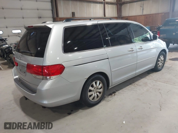 2010 Honda Odyssey EX-L z VIN 5FNRL3H75AB009698, wystawiony jako IAAI lot #42855966 z przebiegiem 215 138 mil mil oraz . Historia ofert i sprzedaży dostępna na DreamBid. Obrazek 4.