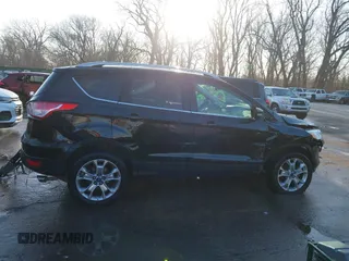 2014 Ford Escape Titanium with VIN 1FMCU0JX0EUC21512, listed as a IAAI auction lot 41781026 with 142,771 mi miles. Bid and sale history available at carsss.com. Image 13.