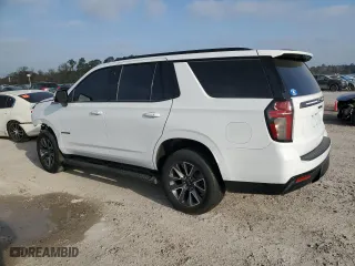 2021 Chevrolet Tahoe Z71 with VIN 1GNSKPKD3MR117317, listed as a Copart auction lot 49102285 with 130,976 mi miles and Salvage Title. Bid and sale history available at carsss.com. Image 2.