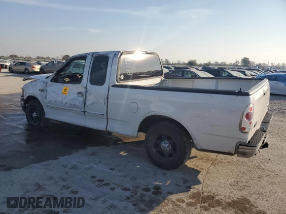 2000 Ford F-150 XL with VIN 1FTZX172XYNB23013, listed as a Copart auction lot 87393774 with 0 mi miles and Salvage Title. Bid and sale history available at carsss.com. Image 2.