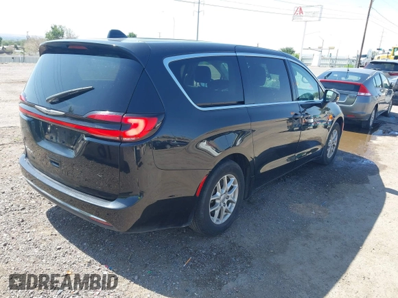 2023 Chrysler Pacifica Touring L with VIN 2C4RC1BG9PR628170, listed as a IAAI auction lot 42515590 with 41,987 mi miles and . Bid and sale history available at DreamBid. Image 4.