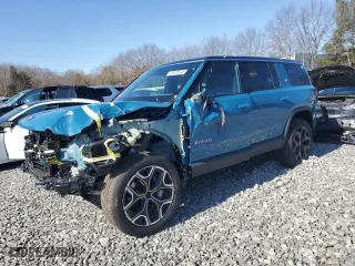 2024 Rivian R1S Adventure with VIN 7PDSGCBA7RN037664, listed as a Copart auction lot 49236015 with 16,496 mi miles and Salvage Title. Bid and sale history available at carsss.com. Image 1.