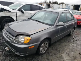 2005 Hyundai Accent GLS z VIN KMHCG45C55U617585, wystawiony jako Copart lot #47449285 z przebiegiem 141 635 mil mil oraz Szkody całkowita. Historia ofert i sprzedaży dostępna na DreamBid. Obrazek 1.