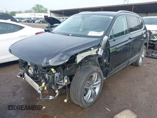 2020 Volkswagen Tiguan SE with VIN 3VV2B7AX8LM177213, listed as a IAAI auction lot 42125606 with 34,578 mi miles and . Bid and sale history available at DreamBid. Image 2.
