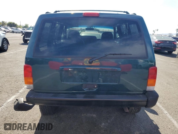 1997 Jeep Cherokee Sport with VIN 1J4FT68S4VL545385, listed as a Copart auction lot 49616325 with 239,798 mi miles and Salvage Title. Bid and sale history available at carsss.com. Image 6.