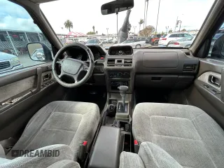 1997 Mitsubishi Montero z VIN JA4MR41R3VJ007919, wystawiony jako Copart lot #51544685 z przebiegiem 268 046 mil mil oraz Czysty tytuł • Clean title. Historia ofert i sprzedaży dostępna na DreamBid. Obrazek 9.