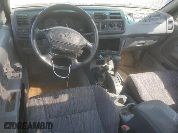 2000 Nissan Frontier XE with VIN 1N6ED27Y4YC382199, listed as a Copart auction lot 47127045 with 207,449 mi miles and Salvage title. Bid and sale history available at DreamBid. Image 8.