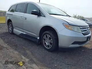 2011 Honda Odyssey EX-L with VIN 5FNRL5H61BB067456, listed as a IAAI auction lot 42131999 with 150,358 mi miles and . Bid and sale history available at carsss.com. Image 1.