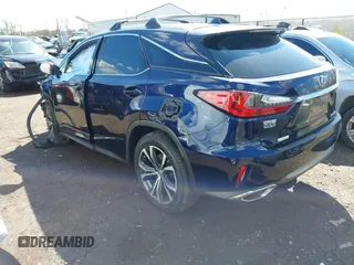 2016 Lexus RX 350 with VIN 2T2BZMCA2GC004895, listed as a IAAI auction lot 41859749 with 104,370 mi miles and . Bid and sale history available at DreamBid. Image 3.