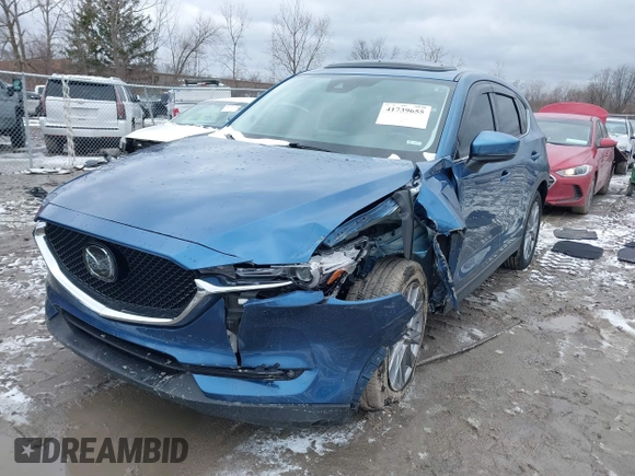 2020 Mazda CX-5 Grand Touring with VIN JM3KFBDM2L0778831, listed as a IAAI auction lot 41739655 with 72,533 mi miles. Bid and sale history available at carsss.com. Image 2.