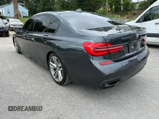 2019 BMW 7 Series 740i xDrive with VIN WBA7E4C55KGV28722, listed as a Copart auction lot 64955445 with 94,901 mi miles and Clean title. Bid and sale history available at DreamBid. Image 2.