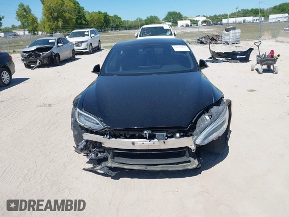 2021 Tesla Model S Plaid with VIN 5YJSA1E66MF452258, listed as a IAAI auction lot 41832000 with 42,845 mi miles and . Bid and sale history available at DreamBid. Image 6.