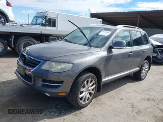 2010 Volkswagen Touareg VR6 with VIN WVGBF7A96AD002466, listed as a IAAI auction lot 41709052 with 204,819 mi miles and . Bid and sale history available at DreamBid. Image 2.