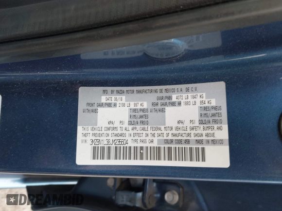 2018 Mazda 3 Touring z VIN 3MZBN1L38JM235604, wystawiony jako IAAI lot #42333995 z przebiegiem 69 541 mil mil oraz . Historia ofert i sprzedaży dostępna na DreamBid. Obrazek 9.