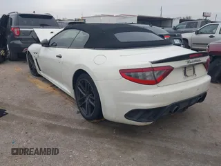 2013 Maserati GranTurismo Convertible Sport with VIN ZAM45VMA9D0070293, listed as a IAAI auction lot 41241020 with 69,156 mi miles. Bid and sale history available at carsss.com. Image 3.