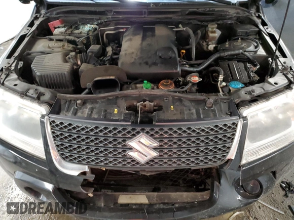 2011 Suzuki Grand Vitara Premium z VIN JS3TD0D24B4103142, wystawiony jako Copart lot #43715135 z przebiegiem 170 422 mil mil oraz Szkoda całkowita • Salvage title. Historia ofert i sprzedaży dostępna na DreamBid. Obrazek 12.