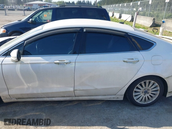2016 Ford Fusion Titanium Hybrid with VIN 3FA6P0RU2GR357739, listed as a IAAI auction lot 42120441 with 151,201 mi miles. Bid and sale history available at carsss.com. Image 14.