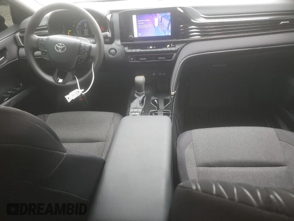2025 Toyota Camry LE with VIN 4T1DAACKXSU043785, listed as a Copart auction lot 52207785 with 9,410 mi miles and Salvage Title. Bid and sale history available at DreamBid. Image 8.