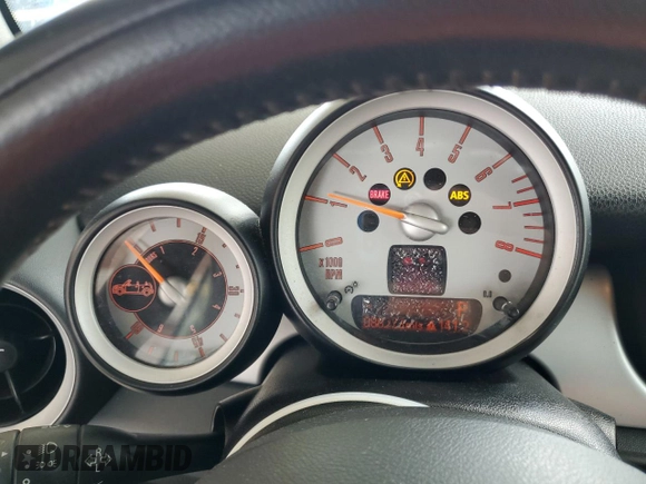 2010 MINI Convertible with VIN WMWMR3C59ATU98597, listed as a Copart auction lot 53336025 with 88,273 mi miles and Salvage Title. Bid and sale history available at DreamBid. Image 9.