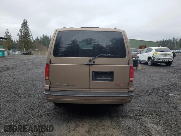 2003 GMC Safari z VIN 1GKEL19X43B503725, wystawiony jako Copart lot #47262655 z przebiegiem 208 200 mil mil oraz Szkody całkowita. Historia ofert i sprzedaży dostępna na DreamBid. Obrazek 6.