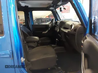 2015 Jeep Wrangler Unlimited Rubicon with VIN 1C4BJWFG7FL661643, listed as a IAAI auction lot 41291385 with 112,785 mi miles. Bid and sale history available at carsss.com. Image 5.