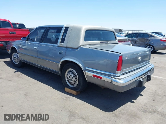 1991 Chrysler New Yorker z VIN 1C3XY66R2MD228813, wystawiony jako IAAI lot #42257734 z przebiegiem 45 786 mil mil oraz . Historia ofert i sprzedaży dostępna na DreamBid. Obrazek 3.
