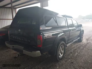 2003 Nissan Frontier 4WD SVE with VIN 1N6MD29Y73C415360, listed as a IAAI auction lot 42093683 with 131,291 mi miles. Bid and sale history available at carsss.com. Image 4.