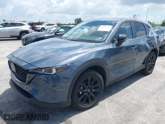 2024 Mazda CX-5 S Carbon Edition z VIN JM3KFBCLXR0521353, wystawiony jako IAAI lot #42351444 z przebiegiem 17 270 mil mil oraz . Historia ofert i sprzedaży dostępna na DreamBid. Obrazek 2.