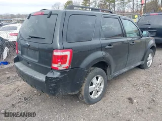 2011 Ford Escape XLT with VIN 1FMCU9D79BKB81857, listed as a IAAI auction lot 41736042 with 999,999 mi miles. Bid and sale history available at carsss.com. Image 4.