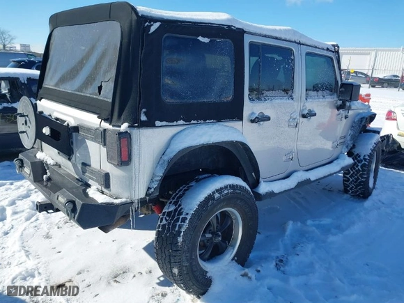 2010 Jeep Wrangler Unlimited Sport with VIN 1J4BA3H11AL102891, listed as a IAAI auction lot 41576869 with 213,204 mi miles. Bid and sale history available at carsss.com. Image 4.